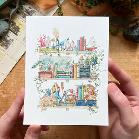 Postcard featuring my original watercolor and ink illustration of the oddities, books, and tools tucked away in the shelves of a vintage sailor, including an inquisitive seagull in a captain’s hat, a diving helmet, and a message in a bottle.

• Printed on high quality card stock
• Each postcard measures 4.25 x 5.5" (A2)