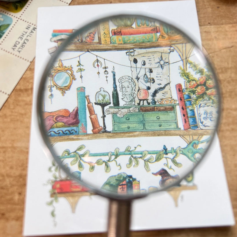 Postcard featuring my original watercolor and ink illustration of the oddities, books, tools, and trinkets tucked away in the shelves of a sea witch, including a sea otter relaxing in a cauldron with a good book.

• Printed on high quality card stock
• Each postcard measures 4.25 x 5.5" (A2)