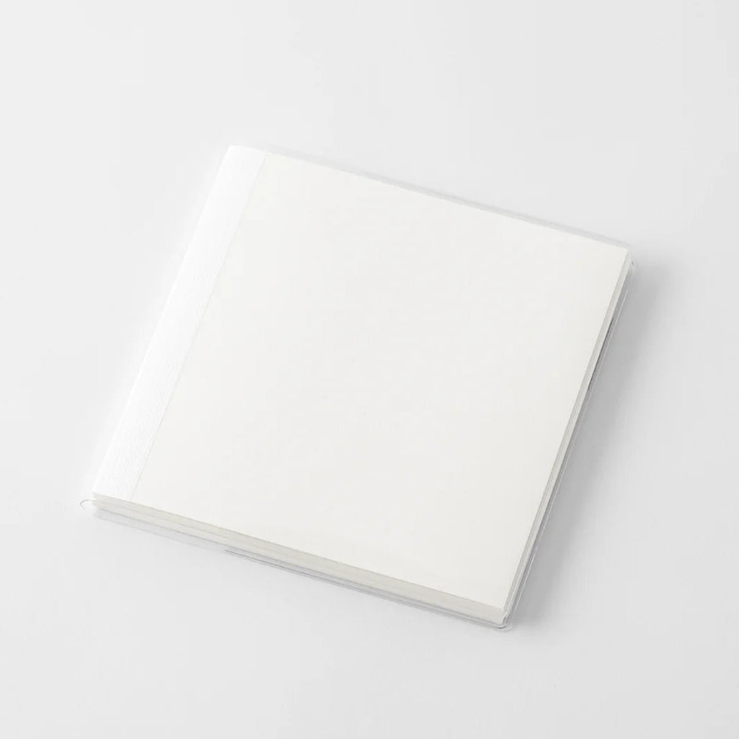 A transparent cover that fits snugly around your MD Notebook

This is a special cover that gently wraps your MD Notebook. The transparent cover protects the notebook from dirt without ruining its appearance.
It subtly protects your notebook from water and dirt without interfering with its characteristics. If you put the cover on with the glassine paper still wrapped around it, the inorganic feel of the vinyl will be softened.
Because it is transparent, you can enjoy the cover design, illustrations, and writ