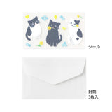 A refreshing stationery design featuring yellow and light blue flowers. On the writing side of the stationery, you can see a cat playing with butterflies in a flower garden.
Stickers adorned with cat gestures like holding flowers in its mouth or giving an upward glance are soothing