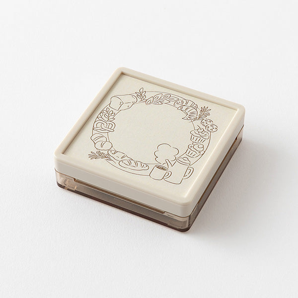 Add header and title to your notes with this cute pre-inked stamp! This is a brown ink (soft color type) that blends well with the colors and decorations of writing instruments. The stamp can be used on its own as a decoration or as a frame for titles and headers in a notebook. Pre-inked stamps are re-inkable using oil-based&nbsp;ink.

Stamp lightly for crisp impressions. Unlike the traditional rubber stamp where you need to press the stamp down and hold, pre-inked stamps work best with stamping lightly, do