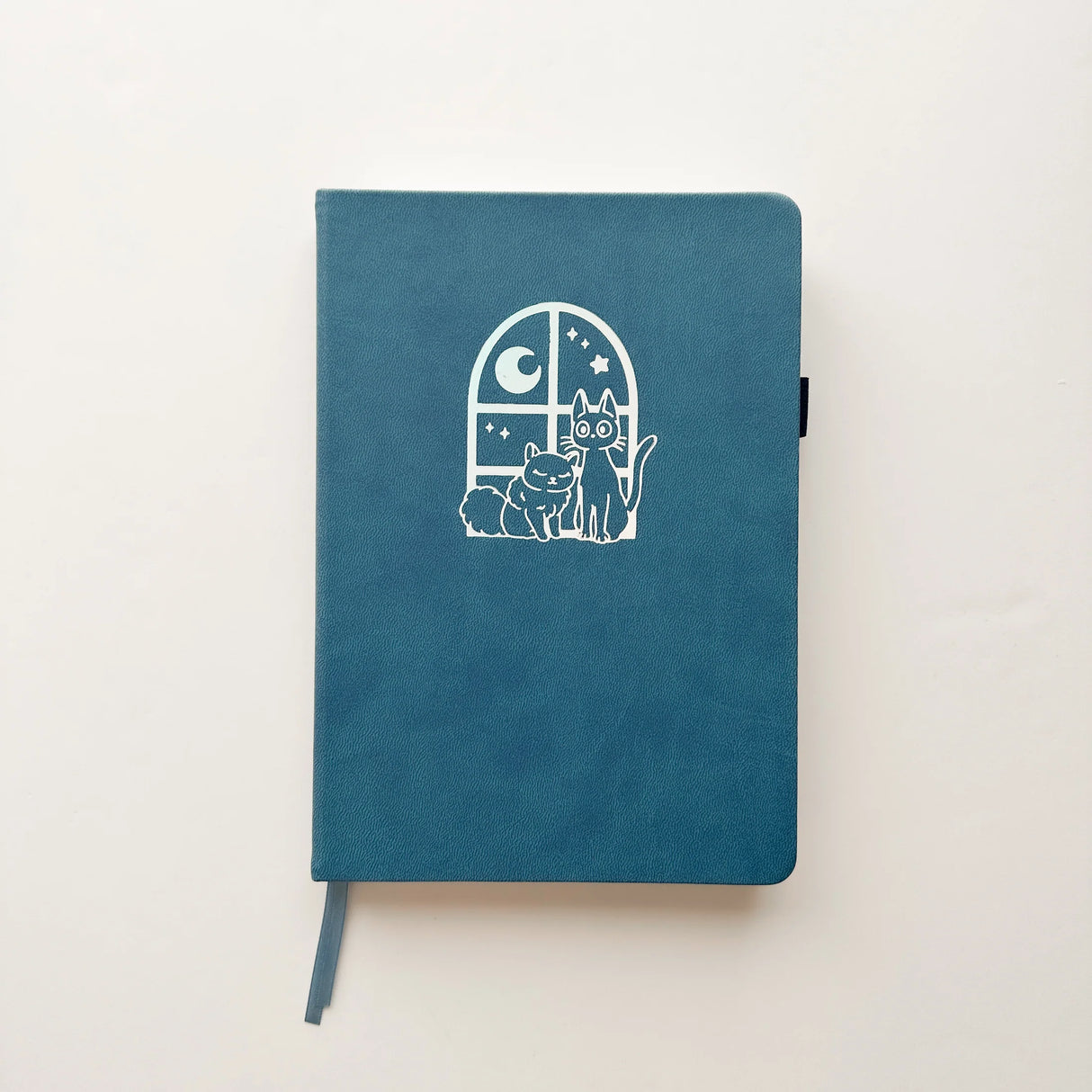 Jiji The Cat Journal in Ocean Blue with Holographic Edges and Logo 🌊✨

Product Details:

Size: A5 (5.70 x 8.26 inches)
160 Dotted Grid Pages (5 x 5 mm)
2 Bookmarks
Elastic Band and Pen Holder
Expandable storage compartment