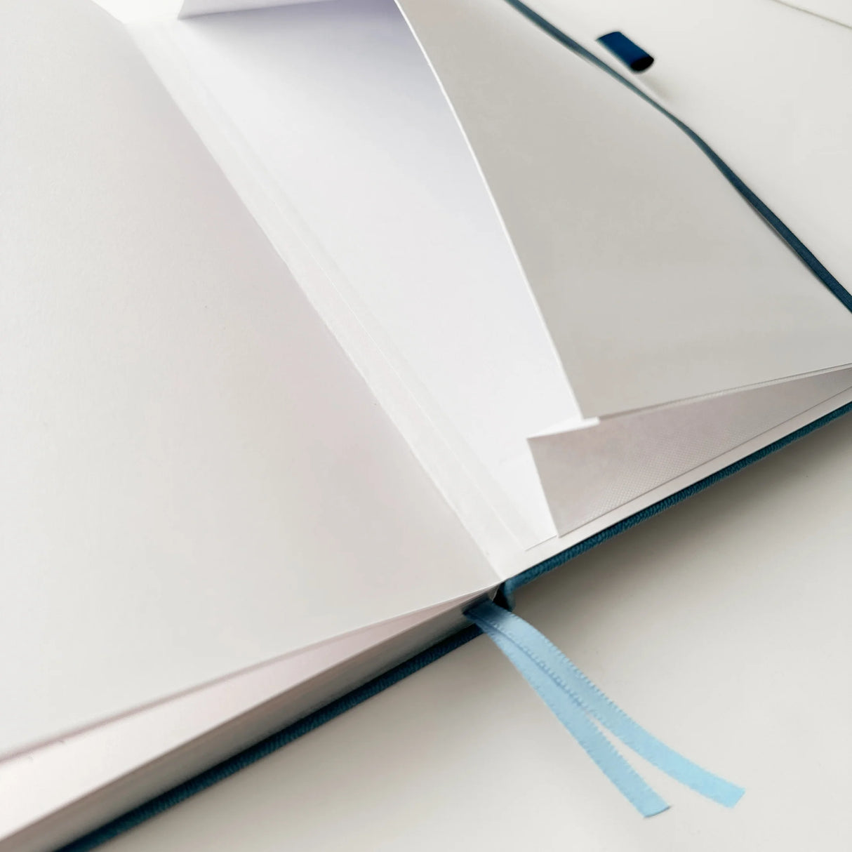 Jiji The Cat Journal in Ocean Blue with Holographic Edges and Logo 🌊✨

Product Details:

Size: A5 (5.70 x 8.26 inches)
160 Dotted Grid Pages (5 x 5 mm)
2 Bookmarks
Elastic Band and Pen Holder
Expandable storage compartment
