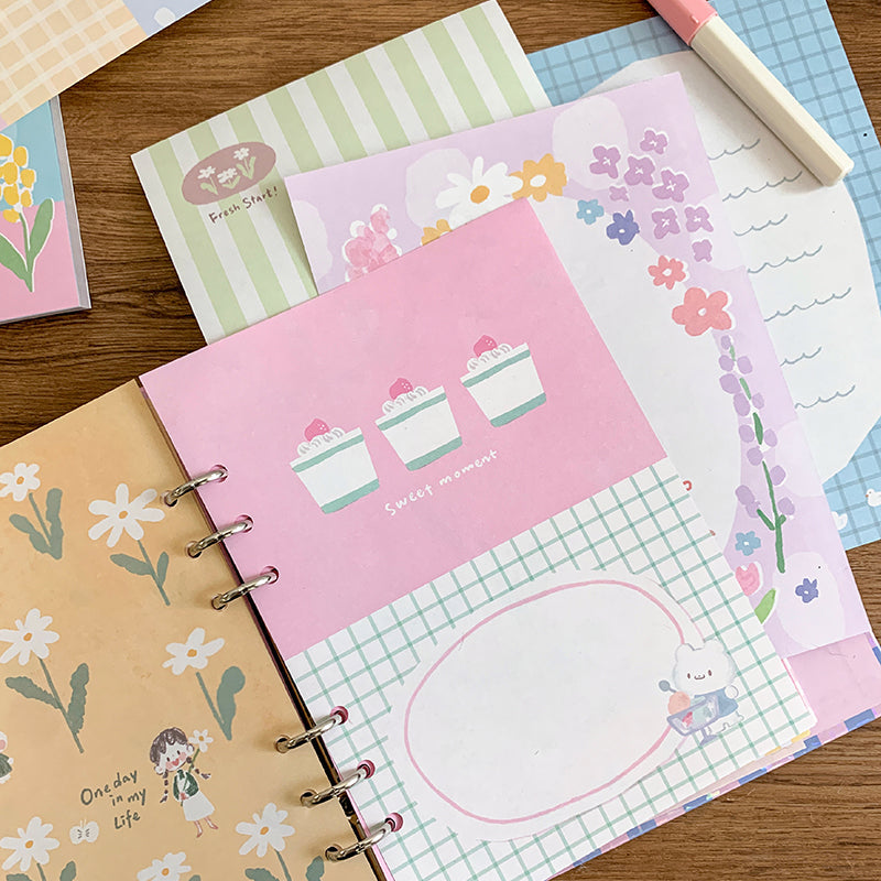 Molinta - Gentle Dreams A5 Colored Notepad

Enjoy 5 sets of 12 different designs that total to 60 sheets that can be used for various purposes such as gift wrapping or making cute collages in your journal!

Specifications: 148mmx210mm
Material: 100g white kraft paper
Full color pages inside
Number of pages: 60