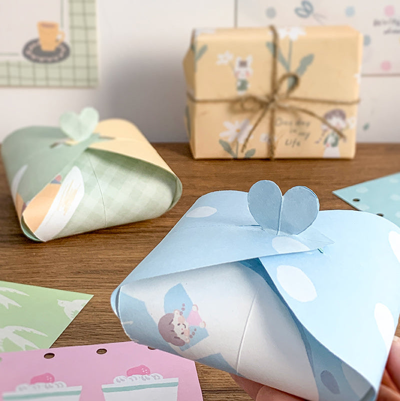 Molinta - Gentle Dreams A5 Colored Notepad

Enjoy 5 sets of 12 different designs that total to 60 sheets that can be used for various purposes such as gift wrapping or making cute collages in your journal!

Specifications: 148mmx210mm
Material: 100g white kraft paper
Full color pages inside
Number of pages: 60