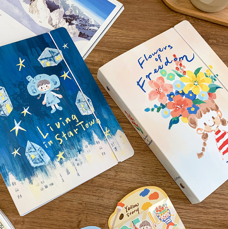 Molinta A5 Organizing Binder - Flowers of Freedom

Designed in a six‑ring format, this binder is perfect for organizing ephemera, sticker sheets, journaling inserts, and creative plans. This&nbsp;A5 binder, gives you plenty of room to store larger pages, decorative layouts, and all the bits and pieces that make your journaling uniquely yours. Whether you're building sticker albums, creating themed spreads, or keeping your notes tidy, this binder offers a beautiful and functional way to keep everything in on