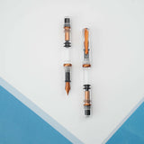 The Original: Summer follows in the footsteps of the provenly popular Original: Spring. Made out of a clear acrylic, the only colored parts of the pen are the: clip, ring, piston and nib. These components have been plated in a bright coppery orange. As always, the Original: Summer uses our in house stainless steel nibs and this demonstrator has a full view of the piston filling system.