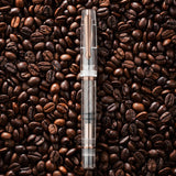 The Original: Fall is still a demonstrator like it’s other seasonal cousins. But this time has been adorned with a warm, coffee-like brown piston, furniture and nib. While this pen does not replace your daily caffeine intake, it may help alleviate some of the sting of working on a chilly fall morning.