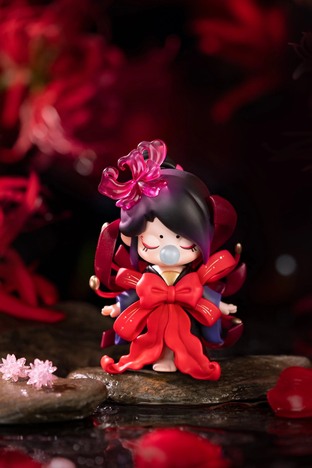 Nanci Flower Stories Figure Dolls Blind Box Small figurine with red outfit and pink hair accessory on a dark background