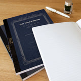 High-quality notebooks are ideal for jotting down ideas, taking notes, sketching, making lists and more. They are perfect for use at home or the office.&nbsp;


Contains silky white, acid free paper that allows for effortless writing.
Notebooks available in ruled, grid and plain paper options.
Heavy duty covers feature a glitter accent.
Silver and gold foil text on the cover also decorate this upscale notebook.
Sturdy thread binding allows the notebook to lay flat for comfortable writing.
Red threading matc