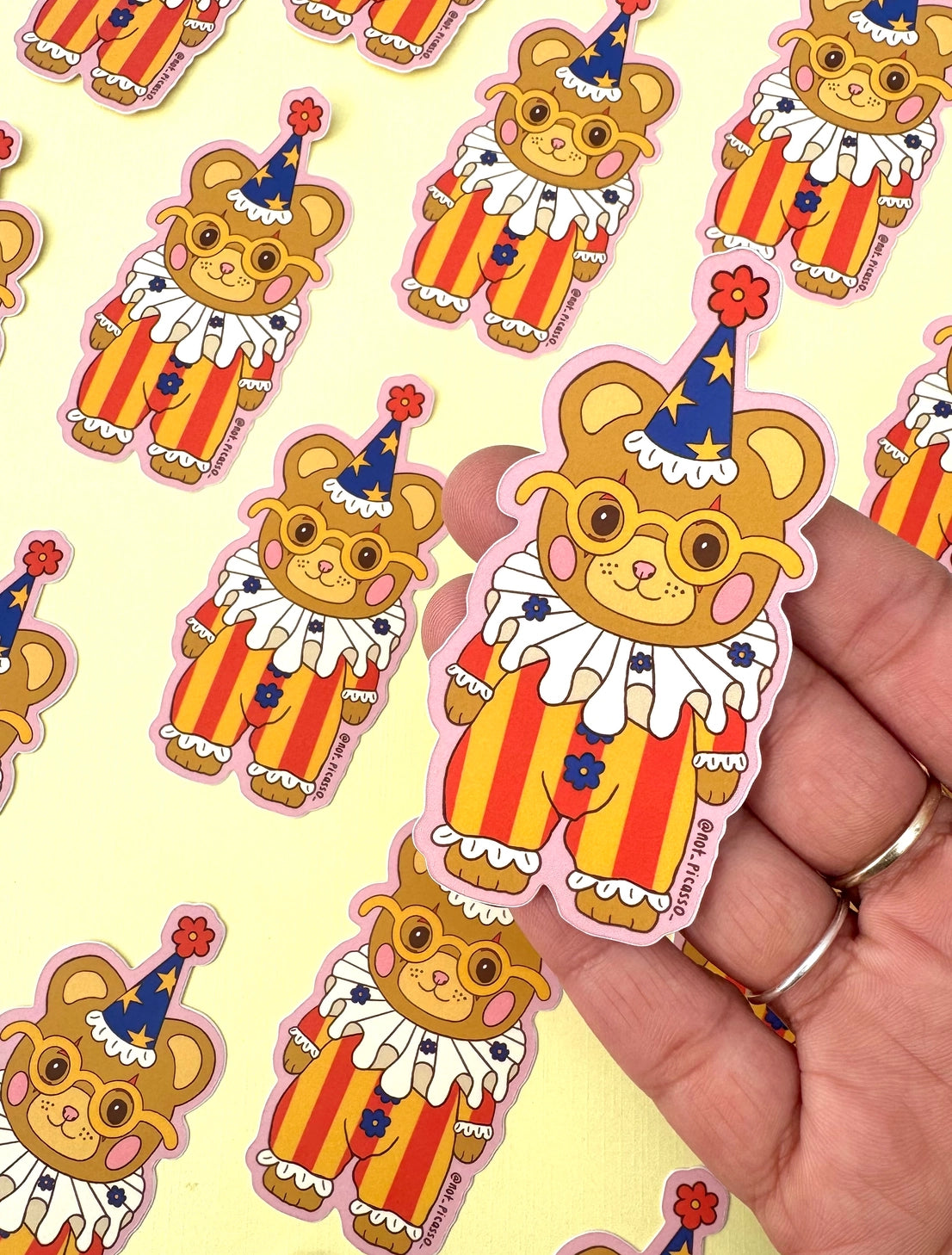 These adorable stickers feature a cute little bear in a clown suit.

These matte vinyl stickers feature an original design and are water, weather, and scratch proof. Perfect for putting on water bottles, computers or just about anywhere else.