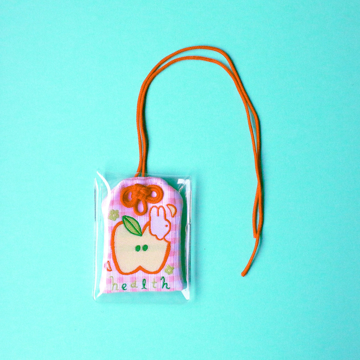 2x2.5 omamori charm with a 8 inch string.

An omamori is a Japanese charm that provides protection and luck!