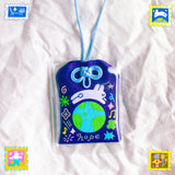 2x2.5 omamori charm with a 8 inch string.

An omamori is a Japanese charm that provides protection and luck!