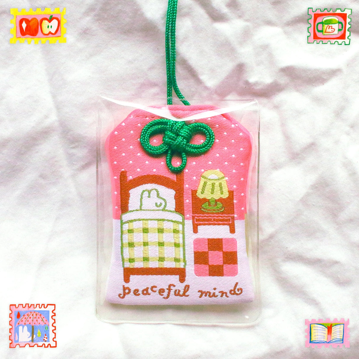 2x2.5 omamori charm with a 8 inch string.

An omamori is a Japanese charm that provides protection and luck!