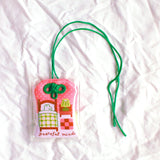 2x2.5 omamori charm with a 8 inch string.

An omamori is a Japanese charm that provides protection and luck!