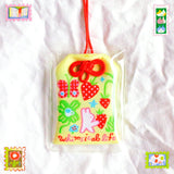 2x2.5 omamori charm with a 8 inch string.

An omamori is a Japanese charm that provides protection and luck!