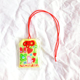 2x2.5 omamori charm with a 8 inch string.

An omamori is a Japanese charm that provides protection and luck!