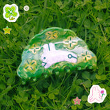 Clover Hair Claw featuring a little rabbit leaping through a field of clover.

Made of acetate, 3.5 inches long.&nbsp;