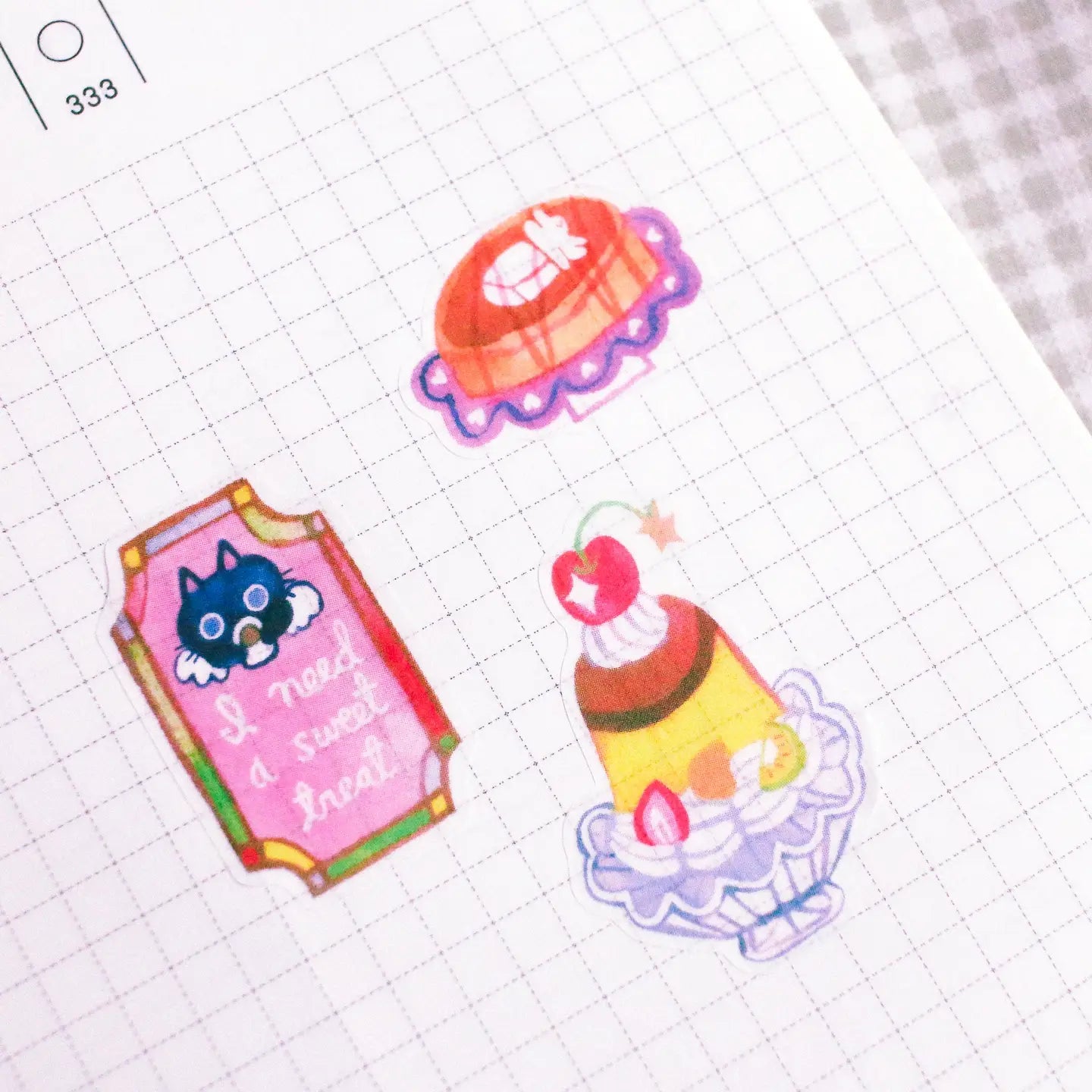 'Dessert at the Kissaten' A6 Washi Sticker Sheet. The material of the sticker sheet is a thin washi paper that is great for journaling!

Sticker sheets are not waterproof and should not be placed in areas of heavy wear (phone cases, laptops, water bottles, etc).
Great for journaling or decorating flat spaces!
Sticker sheets come in a plastic sleeve.