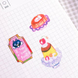 'Dessert at the Kissaten' A6 Washi Sticker Sheet. The material of the sticker sheet is a thin washi paper that is great for journaling!

Sticker sheets are not waterproof and should not be placed in areas of heavy wear (phone cases, laptops, water bottles, etc).
Great for journaling or decorating flat spaces!
Sticker sheets come in a plastic sleeve.