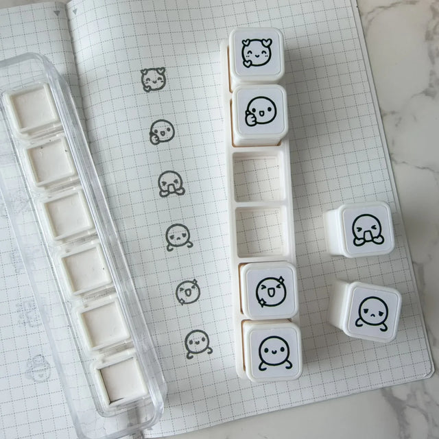 Once More With Love 6 in 1 Punch Stamp - Munchkin Emotions

6-in-1 removable stamps for expressing emotions through Munchkins!

Can be used right in the bracket or taken out for more precise stamping. The stamps are self-inking and come in a transparent case!

***IMPORTANT:&nbsp;Stamps come very well inked. Make sure you use scrap paper to stamp off excess ink prior to using in your notebooks

STAMP SET SIZE:&nbsp;10.75cm&nbsp;(L) x 2.5cm (W) x 2.75cm (H)
INDIVIDUAL STAMP SIZE:&nbsp;1.5cm x 1.5cm
INK COLOUR