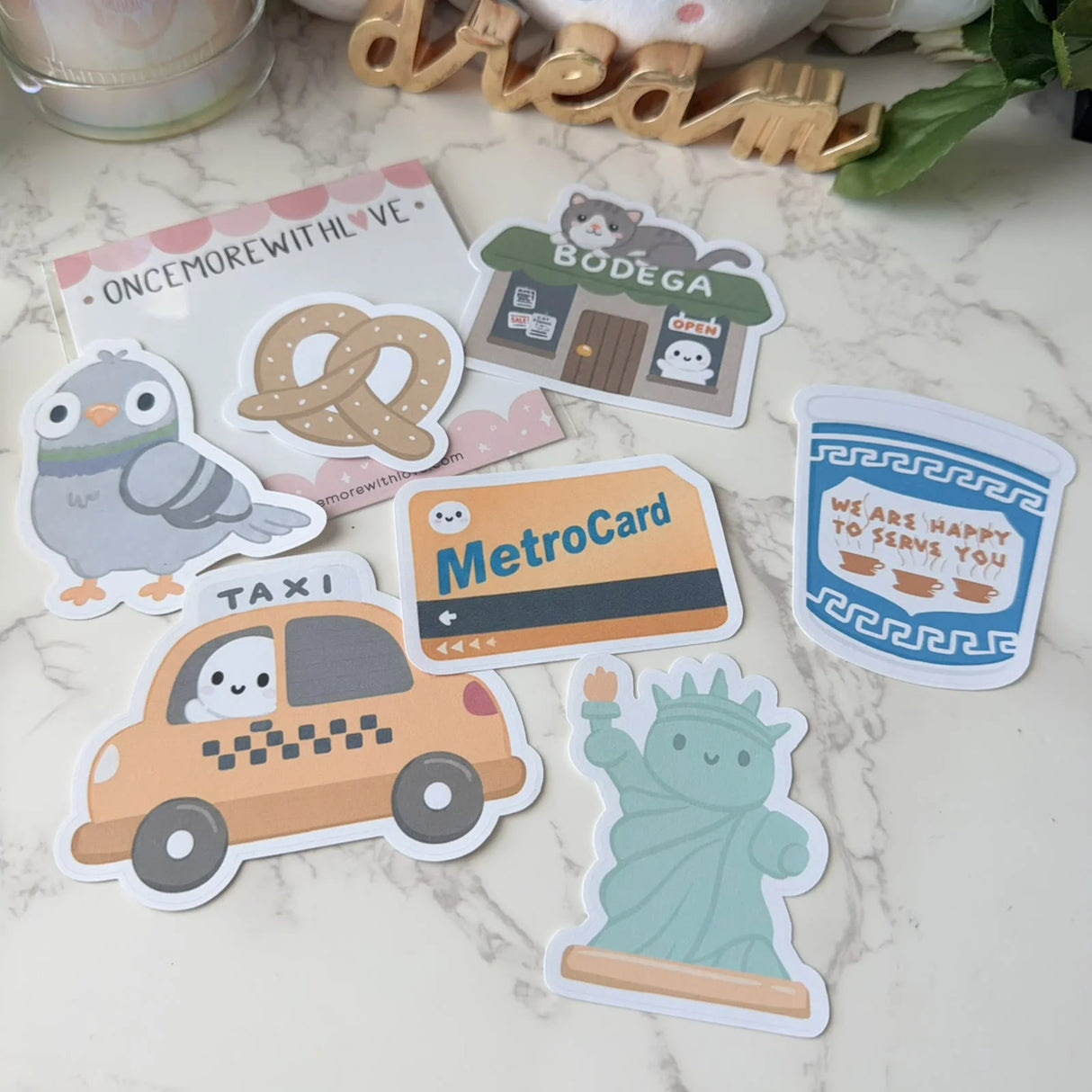 Bring the charm, energy, and personality of New York City to your planner, journal, or craft projects with the Once More With Love Sticker Pack – New York. This adorable vinyl sticker set features expressive characters and city‑themed designs that add a fun, whimsical touch to any creative spread.

Includes 7 Stickers