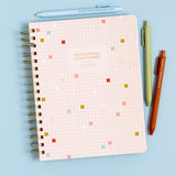 Stay organized and inspired with the Professional Overthinker Spiral Notebook! Featuring lined pages for all your thoughts, lists, and brainstorms, this 7” x 9” wire-bound notebook is perfect for journaling, note-taking, or planning your next big idea. The playful cover design makes it a great desk companion or a fun gift for students, writers, teachers, or anyone who loves to jot things down. Whether you’re tackling to-do lists or letting your creativity flow, this stylish and functional notebook is here t