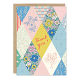 Quilt Thank You Card

Inside verse: So very much!

• Size: A6, 4.6" x 6.4"
• Illustrated by Emily Taylor
• Full-color inside
• Foil treatment
• Paired with a Brown Kraft envelope
• Printed in the USA on high-quality recycled post-consumer waste paper
• Pre-priced

About the Artist: Emily Taylor draws and daydreams from her studio in a tiny town north of Toronto, Canada. Her work is best known for its feel of modern nostalgia, its painterly linework and joyful colors. Emily is inspired most by walks in natur