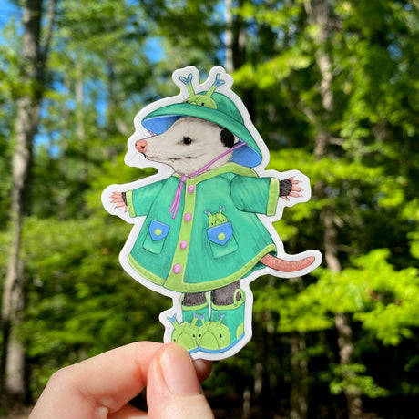 This weatherproof vinyl sticker features my illustration of a opossum dressed up in caterpillar rain gear.


This die-cut gloss 4” vinyl sticker is durable, weatherproof, and perfect for water bottles, notebooks, laptops, bikes, and all sorts of other surfaces! Make sure to clean and dry the surface thoroughly before applying.