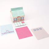 Ramus &amp; Co. - Cottage Note Carton

Fresh notes, served daily! This Ramus &amp; Co. mini carton comes filled with 200 handy 3×3 inch paper notes (in four different designs!), perfect for quick lists, messages, and bright ideas.

Simply remove the perforated door on the front for quick access whenever inspiration strikes. Equal parts practical and gift-able, it’s a cheerful addition to any desk, kitchen counter, or workspace!

4 x 4 inch note carton holder
(200) 3 x 3 inch paper notes
4 unique note design