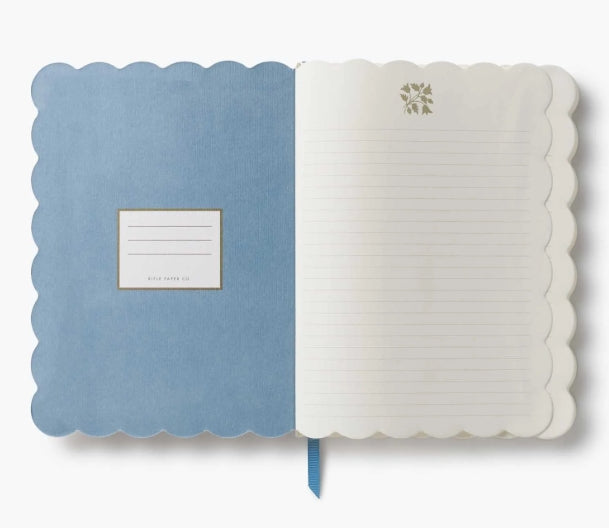 Rifle Paper Co. - Helena Softcover Journal

A lightweight, scallop-edge journal, perfect for work, school, and other daily tasks. Inside, find 150 lined pages and a grosgrain ribbon bookmark.

DETAILS
- Linen textured paper-wrapped hardboard cover
- Uncoated natural white text paper interior
- Die-cut edges
- Grosgrain ribbon bookmark
- 150 lined pages
- 6.25" W x 8.5" L