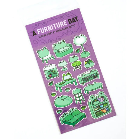 This is part of a new series of sticker sheets that feature different "days".

There are 20 individual stickers on the sheet full of frog furniture.

They are vinyl stickers on a clear plastic sheet with a backing card.

The whole packaging is 3.8 x 8.75" and is ready to hang.
The sticker sheet is 3.75 x 5.8"