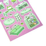 This is part of a new series of sticker sheets that feature different "days".

There are 20 individual stickers on the sheet full of frog furniture.

They are vinyl stickers on a clear plastic sheet with a backing card.

The whole packaging is 3.8 x 8.75" and is ready to hang.
The sticker sheet is 3.75 x 5.8"
