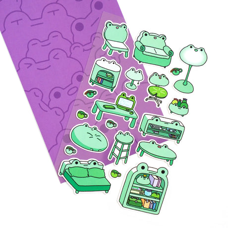 This is part of a new series of sticker sheets that feature different "days".

There are 20 individual stickers on the sheet full of frog furniture.

They are vinyl stickers on a clear plastic sheet with a backing card.

The whole packaging is 3.8 x 8.75" and is ready to hang.
The sticker sheet is 3.75 x 5.8"
