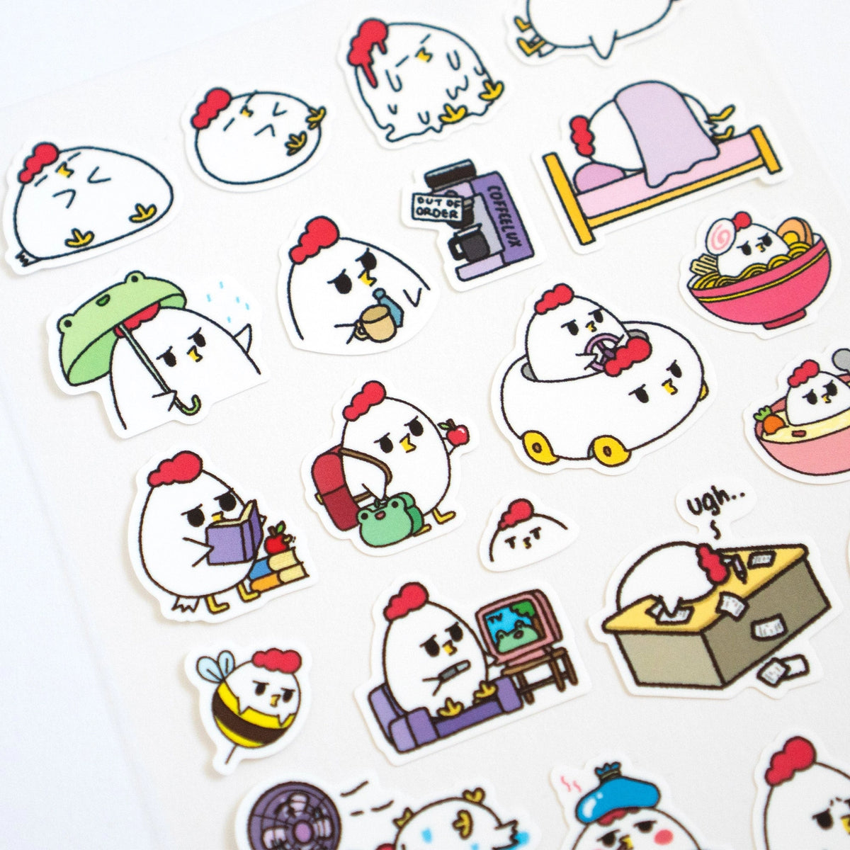 Grumpy Chicken is all sorts of moods, but mostly grumpy.

There are 27 individual stickers on the sheet.

They are vinyl stickers on a clear plastic sheet with a backing card.

The whole packaging is 3.8 x 8.75" and is ready to hang.
The sticker sheet is 3.75 x 5.8"