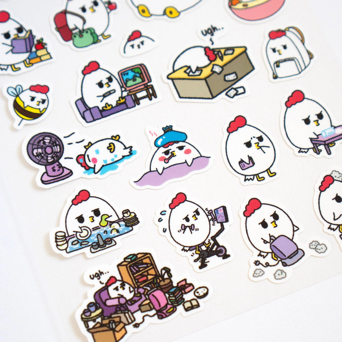 Grumpy Chicken is all sorts of moods, but mostly grumpy.

There are 27 individual stickers on the sheet.

They are vinyl stickers on a clear plastic sheet with a backing card.

The whole packaging is 3.8 x 8.75" and is ready to hang.
The sticker sheet is 3.75 x 5.8"