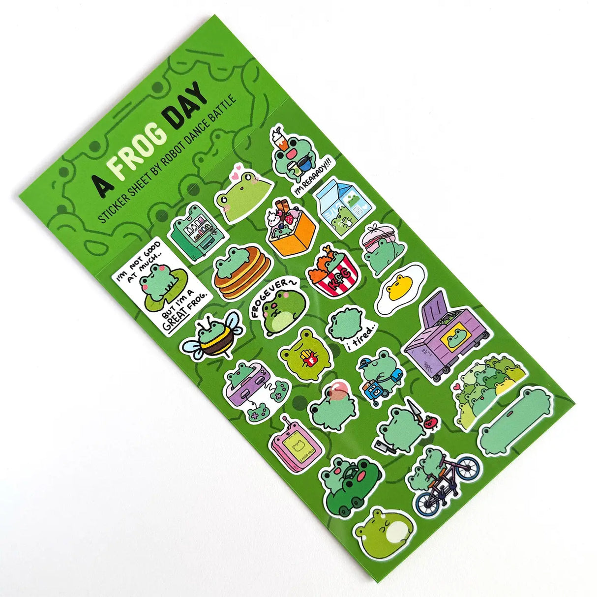 This is part of a new series of sticker sheets that feature different "days".

There are 25 individual stickers on the sheet full of FROGS.

They are vinyl stickers on a clear plastic sheet with a backing card. The bag has a hanging hole for retail display.

The whole packaging is 3.8 x 8.75" and is ready to hang.
The sticker sheet is 3.75 x 5.8"