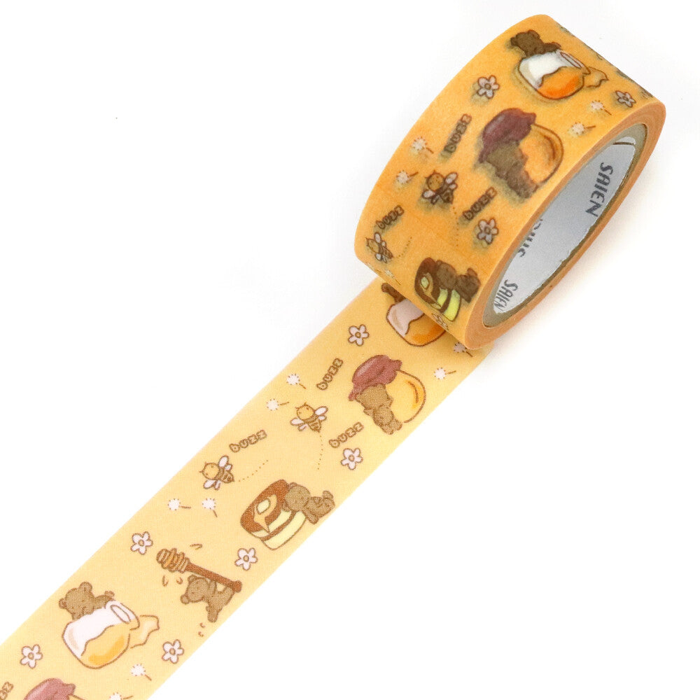 This tape is all about cozy woodland sweetness. The design features a gentle, soft‑brown bear illustrated in SAIEN’s signature warm watercolor style, happily enjoying honey from little pots scattered along the tape. The bear appears in multiple charming poses, sniffing a honey pot, holding it close, or dipping a paw inside, giving the pattern a playful, story‑like flow.