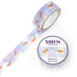 A tiny summer festival dances across this tape, goldfish drifting like living lanterns while fireworks bloom above them in soft bursts of color. The light blue background feels like evening sky over a festival pond, where goldfish glide lazily beneath shimmering reflections and the night hums with celebration.