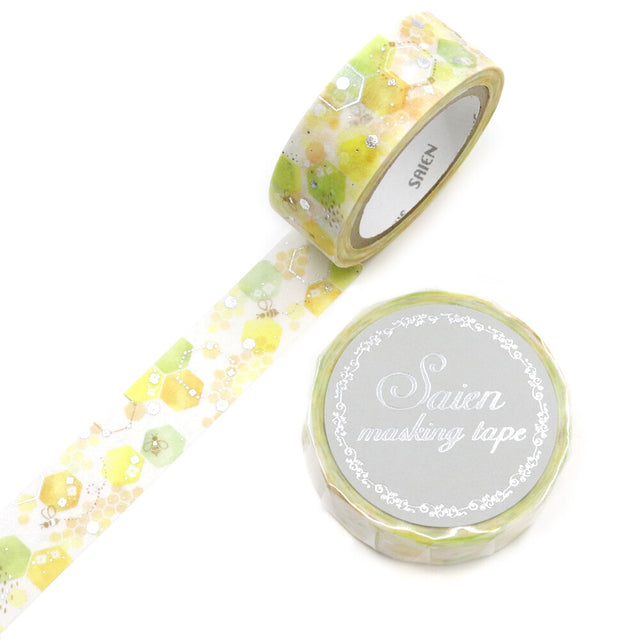 A soft watercolor honeycomb drifts across this tape in gentle yellows and greens, capturing the quiet charm of a sunny garden morning. The translucent Japanese paper lets each hexagon glow lightly, giving the design a fresh, airy sweetness, like sunlight slipping through leaves. Part of SAIEN’s Time of Fruits series, it pairs delicate color with the signature softness of traditional washi.