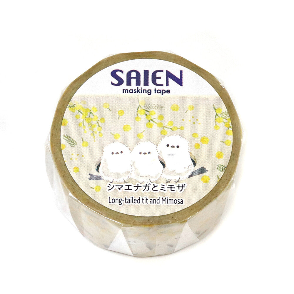 The Shima Enaga is depicted in its signature round, snow‑white form with tiny black eyes and a delicate tail, perched sweetly among clusters of golden mimosa flowers. The artwork has a soft watercolor feel, giving the tape a light, airy aesthetic that feels both elegant and irresistibly cute.