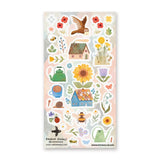 🌻🐝 With @raahatkaduji the day begins with warm tea, open windows, and an owl carrying letters through the blooms. Sunflowers tower over quaint blue cottages, bees wander through dandelions, and watering cans rest among fresh-picked flowers. With teapots, ladybugs, and hand-painted florals tucked throughout, this sheet brings a tender touch of countryside comfort.

Art by: @raahatkaduji

One sticker sheet is included.

• Top Coating: None
• Adhesive Layer: Paper
• Backing Layer: Paper
• 6.69"x3.54"
• Weigh