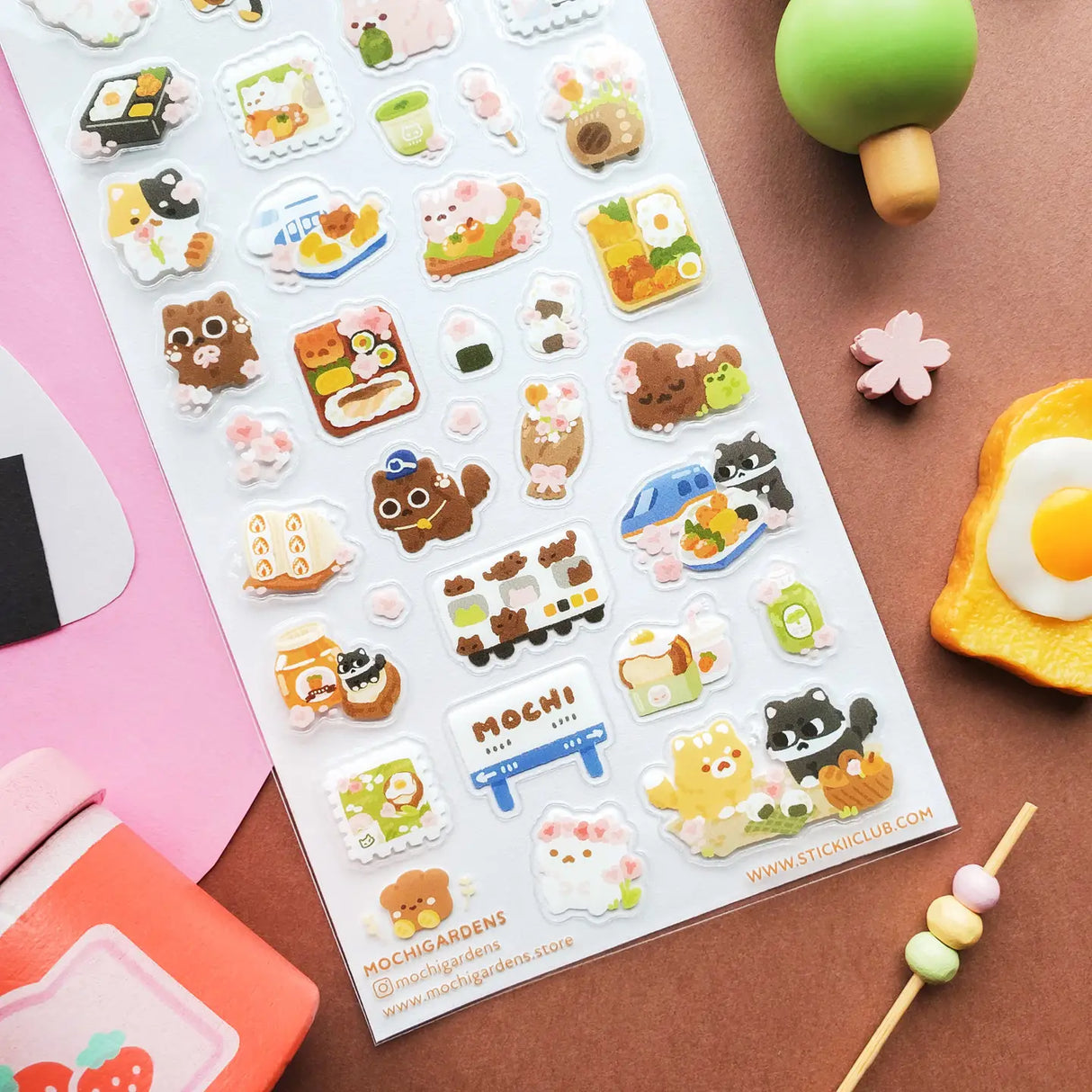STICKII - Blooming Bento Day Sticker Sheet

🌸🍱 @mochigardens’ sweet kitties are enjoying a dreamy spring picnic in Japan, filled with cherry blossoms, yummy bento boxes, and kawaii snacks at every stop. From rolling through town on little trains to sharing mochi, matcha treats, and beautifully packed lunches, these cuddly kitties know how to savor the season. Art by: @mochigardens

Top Coating: None
Adhesive Layer: Paper
Backing Layer: Paper
6.69" x 3.54".
Weight - 0.03lbs.
1 sheet included &nbsp; &nbsp;