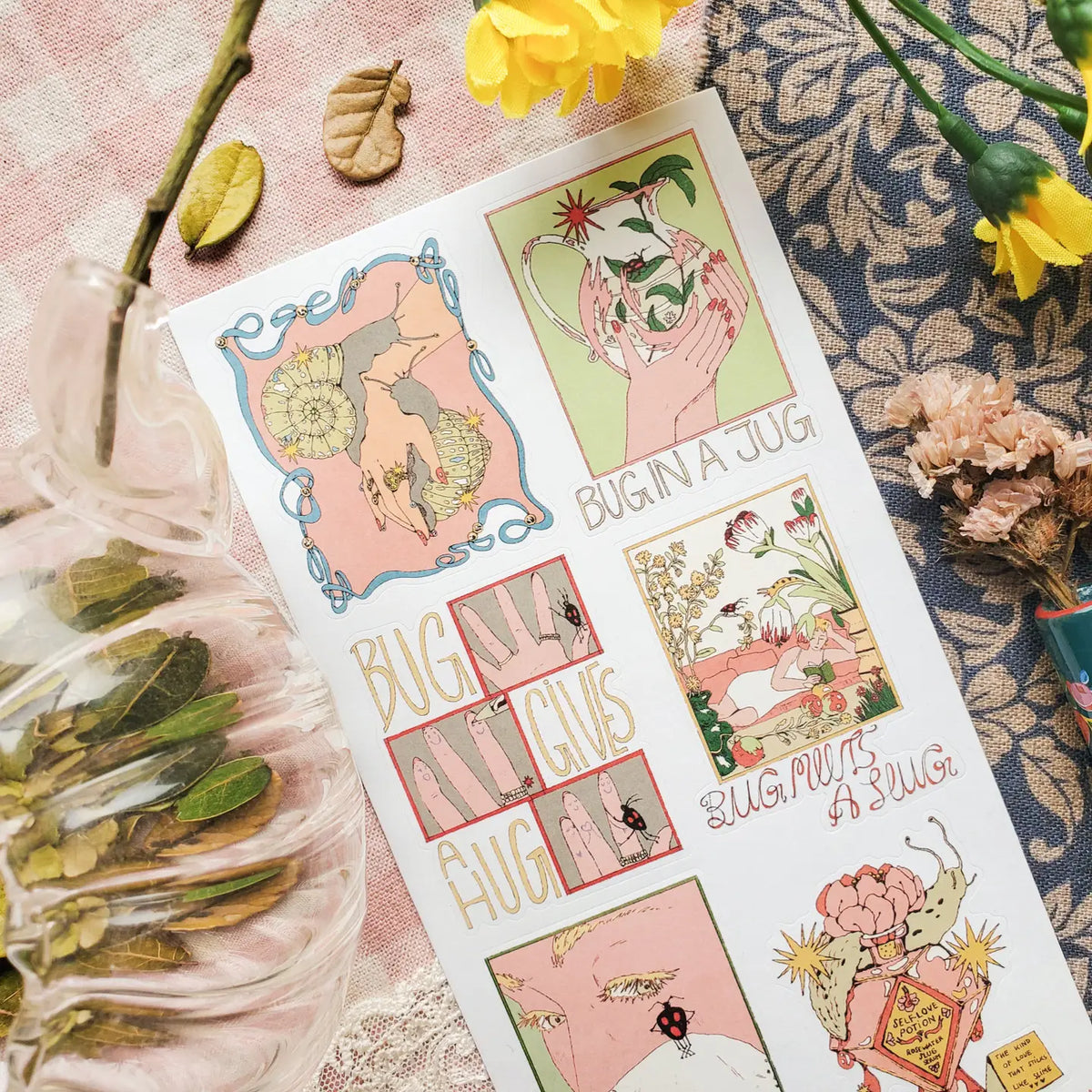 🐌💐 @simone.goder’s sheet is crawling with tiny romance, fun florals, and tender little moments for the bugs we don’t always stop to adore. From a bug tucked inside a jug to a beetle on a rug, snails being lovingly held, and a slug mixing up a self-love potion, these are definitely giving big feelings, tiny legs, and a whole lot of buggy charm.

Art by: @simone.goder

• One sticker sheet is included.
• Top Coating: None
• Adhesive Layer: Paper
• Backing Layer: Paper
• 6.69"x3.54"
• Weight-0.03oz
• 1 Sheet 