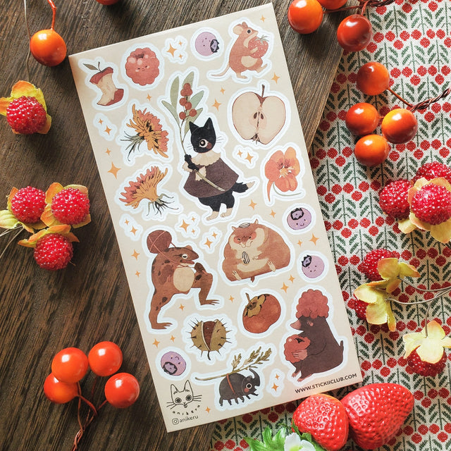 🐹🍎 In @anikeru’s whimsical corner of the woods, autumn’s bounty is gathered by the sweetest of friends. A dapper black cat carries fresh berries, mice and hamsters tuck into plump fruits and seeds, and a toad carries treasures on its back. It’s a season painted in warmth, where every creature has a story to share.