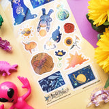 ☀️✨ Turn up the cosmic heat with @wizard.legs’ brilliant solar squad! From a chilled-out sun bear and a groovy dino-sun to a slick sunfish just vibing in its own bubbles, this sun-themed entourage has range while sunflowers, space explorers, and stellar oddballs whirl around in radiant orbit. It’s a whole universe of suns, each shining in their own wonderfully weird way.