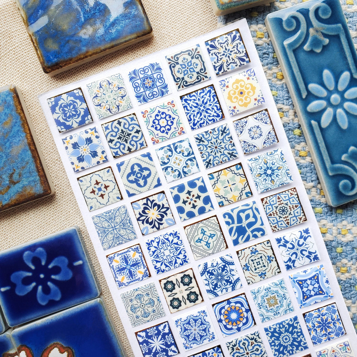 STICKII Azure Whimsy Tiles Sticker Sheet

💙✨ Bring timeless elegance to your creations with this stunning sheet of vintage tiles patterned with intricate designs and shimmering foil accents. From dainty florals to bold geometrics, every square echoes the artistry of classic ceramics in rich shades of blue and gold.