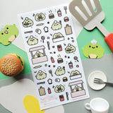 🍔🐸 Say hello to the cutest chef in town! @keziacreations’ adorable little froggy is busy in the kitchen flipping patties and serving up smiles. From sizzling burgers to crispy fries and fizzy drinks, this tiny chef is here to make your heart (and tummy) hoppy.

Art by: @keziacreations

Top Coating: None
Adhesive Layer: Paper
Backing Layer: Clear PET
6.69" x 3.54".
Weight - 0.03lbs.
1 sheet included&nbsp;