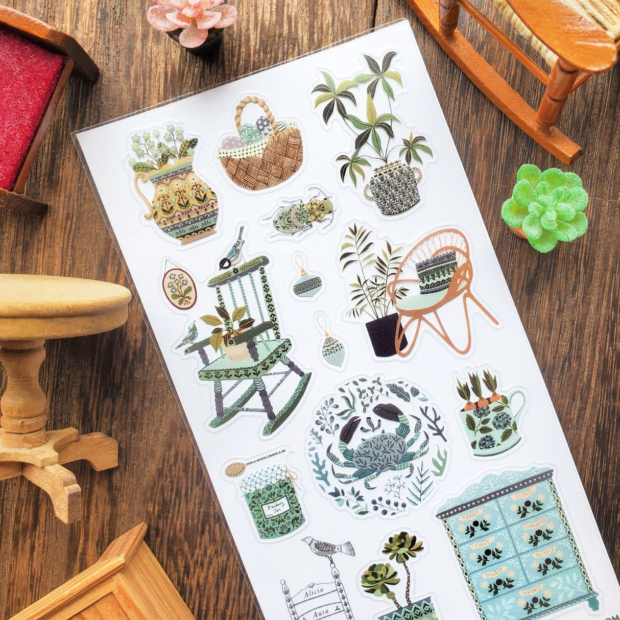 STICKII Serene Botanical Home Sticker Sheet

🪴🪑 In a quaint cottage by the sea, rocking chairs wait by sunny windows, painted pots overflow with plant life, and a spice cabinet murmurs its secrets. With gorgeous details and soft blue hues, @aliciauraa’s designs take us to a serene home where every object holds a story.