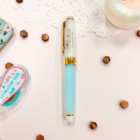 Sailor&nbsp;Limited Edition Professional Gear Slim Fountain Pen - Cinnamoroll

Discover a charming collaboration between Sailor Fountain Pen and Sanrio’s beloved character, Cinnamoroll! This limited-edition fountain pen captures the elegant and adorable world of Cinnamoroll, featuring luxurious gold accents on the clip and ring, along with special Cinnamoroll logo motifs on the cap, finial, and nib. The 14k gold nib is beautifully engraved with Cinnamoroll’s face, adding a delightful touch to this unique wr